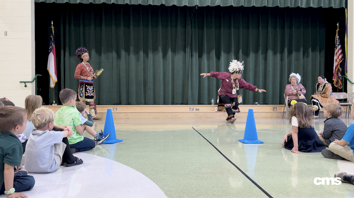  Students enjoy a traditional Native American dance performance